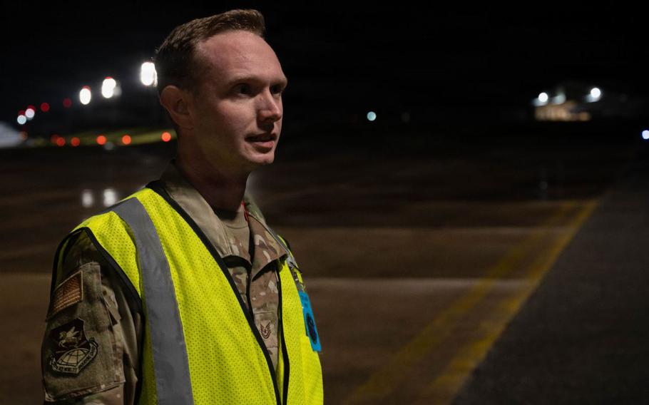 U.S. Air Force Tech. Sgt. Brian Huntley, 733rd Air Mobility Squadron aerospace propulsions technician, and wing inspection team member, observes Airmen for discrepancies during a U.SAF-led operational exercise Beverly Midnight 26 at Kadena Air Base, Japan.